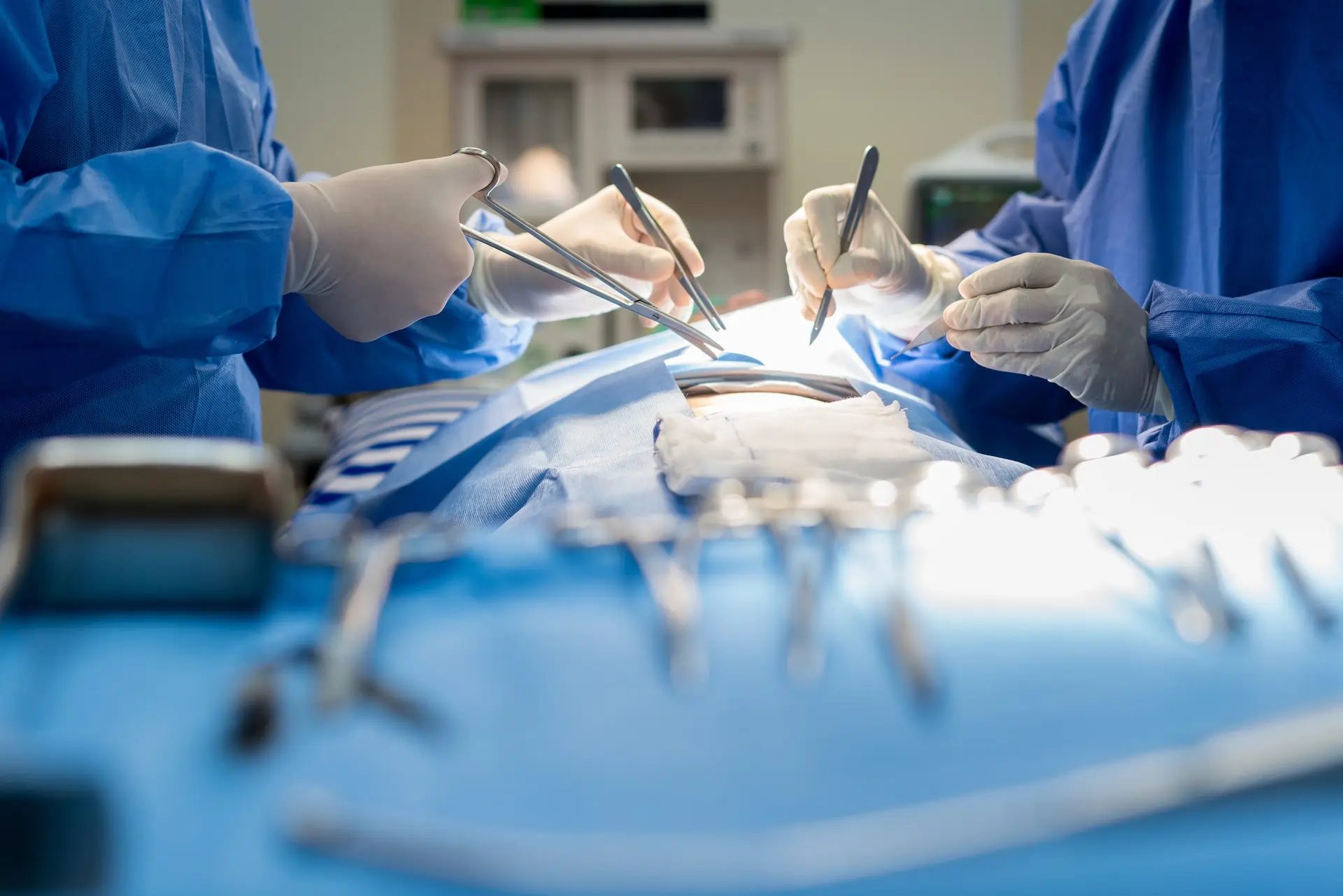A team of podiatric surgeons during a procedure.